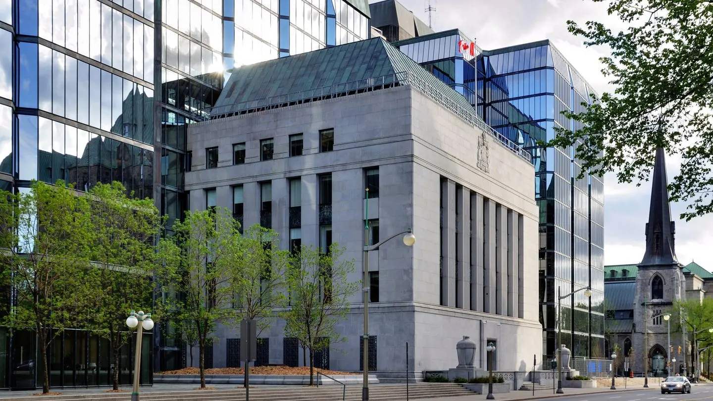The Bank of Canada building in Ottawa, flanked by glass office towers