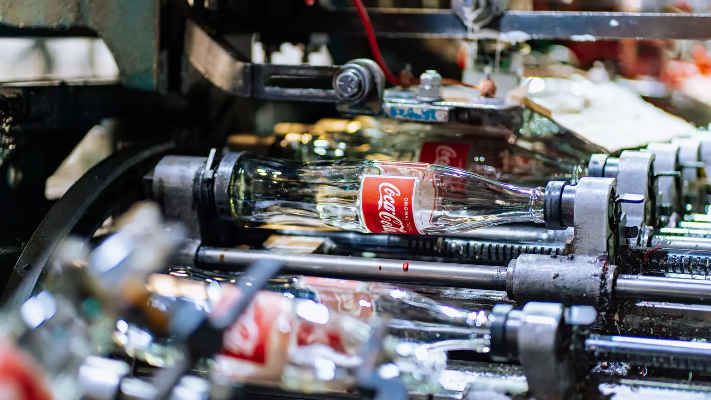 Glass bottles on a production line in factory.