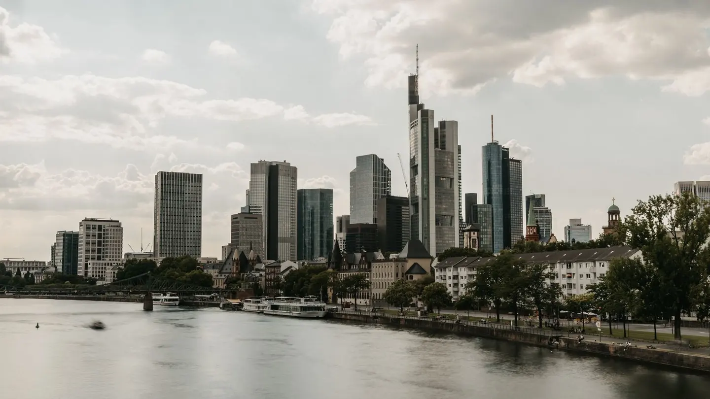 Skyscrapers by river in frankfurt.