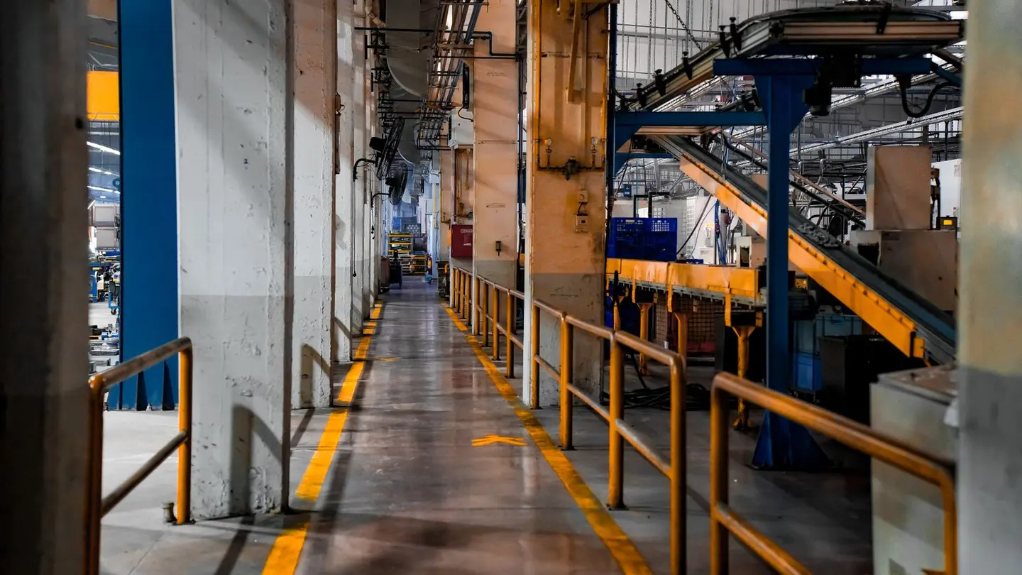 Industrial factory interior with conveyor.
